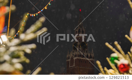 Spasskaya Tower of Moscow Kremlin on snowy New Year's Eve Spasskaya Tower of Moscow Kremlin on snowy New Year's Eve 129821513