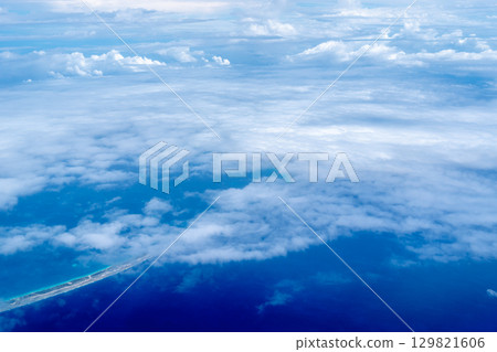 Aerial view of the Tuamotus atoll in French Polynesia with clouds 129821606