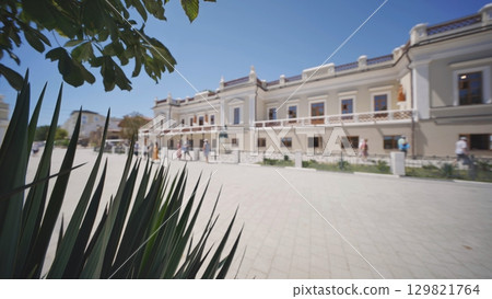 A street plant against the background of buildings in Feodosia, Crimea. A street plant against the background of buildings in Feodosia, Crimea. 129821764