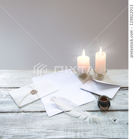 Envelope and paper with pen on the table 129822013