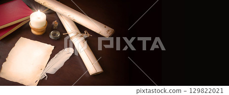 Paper and quill on the table Paper and quill on the table 129822021
