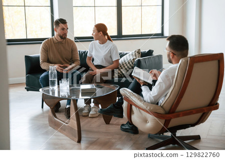 Sitting and talking. Couple at a psychologist's appointment 129822760