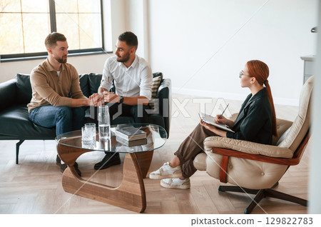 Conception of love. Gay couple at a psychologist's appointment 129822783
