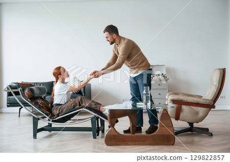 Woman is sitting in chair at an appointment with a psychologist Woman is sitting in chair at an appointment with a psychologist 129822857