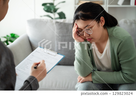 Psychologist doctor examine and listen and talking to patient with depression, mental health concept 129823024