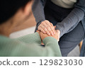 Psychologist or family holding hands to encourage patient with depression, mental health concept 129823030