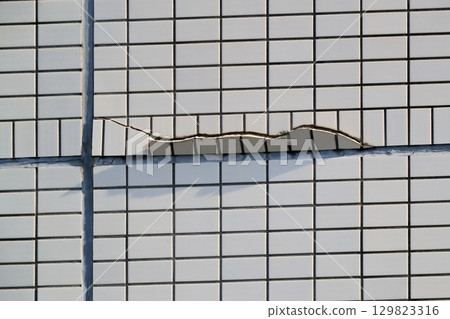 Cracks in the outer wall tiles image Cracks in the outer wall tiles image 129823316