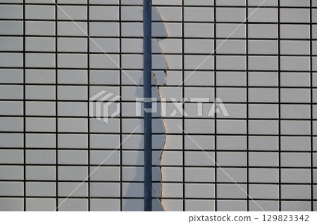 Cracks in the outer wall tiles image Cracks in the outer wall tiles image 129823342