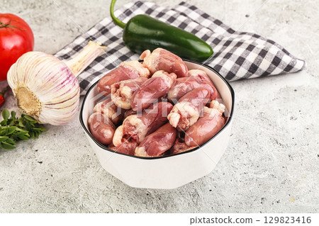Fresh raw chicken hearts in the bowl 129823416