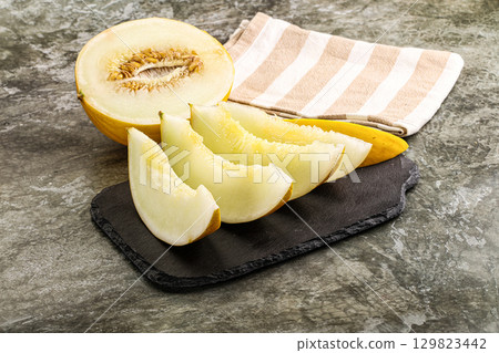 Sweet juicy ripe melon slices Sweet juicy ripe melon slices 129823442