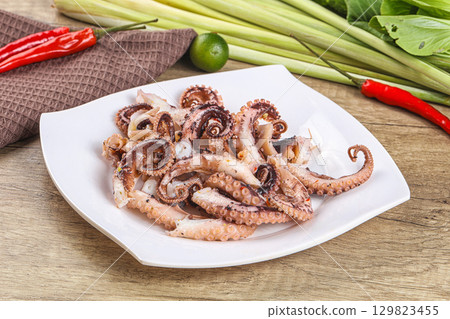 Grilled octopus tentacle sliced appetizer 129823455