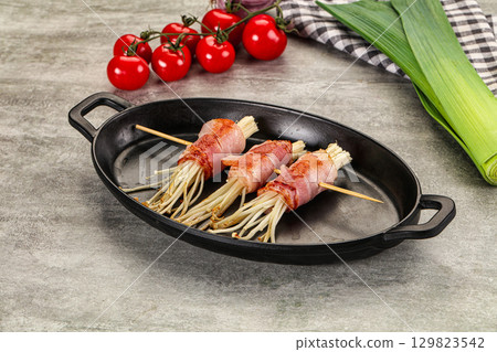 Grilled enoki mushroom with bacon Grilled enoki mushroom with bacon 129823542