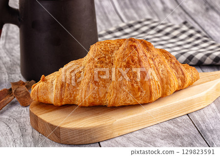 Fresh hot homemade croissant for breakfast Fresh hot homemade croissant for breakfast 129823591