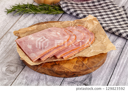 Sliced porjk ham over boatd Sliced porjk ham over boatd 129823592