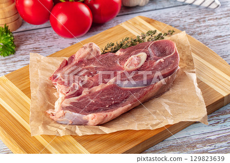 Raw lamb steak with bone 129823639