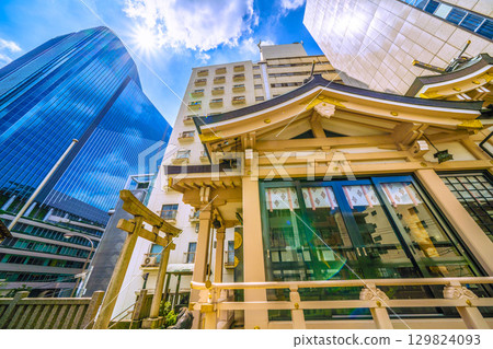 Tokyo cityscape in Japan, including Inari Shrine in front of Takanawa Gateway City Tokyo cityscape in Japan, including Inari Shrine in front of Takanawa Gateway City 129824093