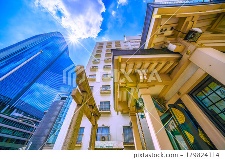 Tokyo cityscape in Japan, including Inari Shrine in front of Takanawa Gateway City Tokyo cityscape in Japan, including Inari Shrine in front of Takanawa Gateway City 129824114