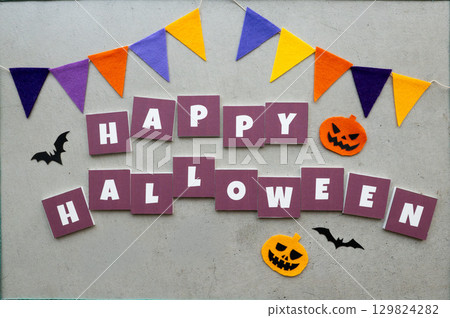 Halloween decorations on a concrete background 129824282