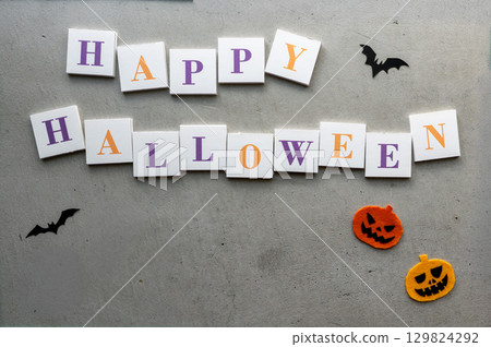 Halloween decorations on a concrete background 129824292