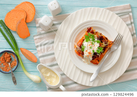 sweet potato casserole with bacon, cheese, onion 129824496