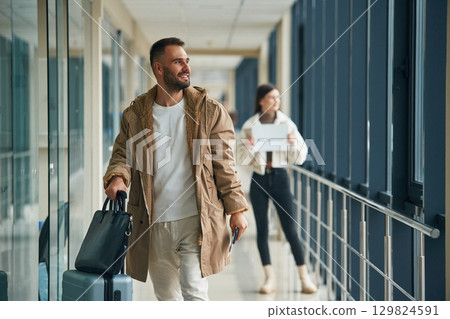 Couple are in the airport hall together 129824591