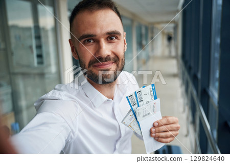 Making selfie, happy facial expression. Young handsome man in the airport 129824640
