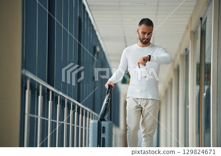 Young handsome man in the airport Young handsome man in the airport 129824671