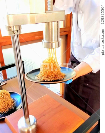 A pastry chef perfecting a Mont Blanc made with freshly squeezed Japanese chestnuts A pastry chef perfecting a Mont Blanc made with freshly squeezed Japanese chestnuts 129825504