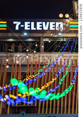 Night view of a 7-Eleven store with colorful string lights in Hangang river park in Seoul, South Korea Night view of a 7-Eleven store with colorful string lights in Hangang river park in Seoul, South Korea 129825956