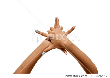 Two hands intertwined with fingers extended upward isolated on white Two hands intertwined with fingers extended upward isolated on white 129826457