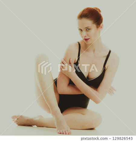 Attractive woman in black swimsuit style underwear Attractive woman in black swimsuit style underwear 129826543