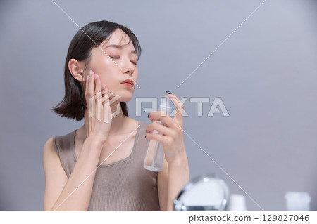 Beauty image: Young woman doing skin care 129827046