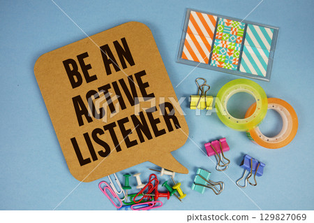 Be An Active Listener text with stationery on blue background 129827069