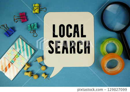 Local Search text with magnifying glass on blue background 129827099