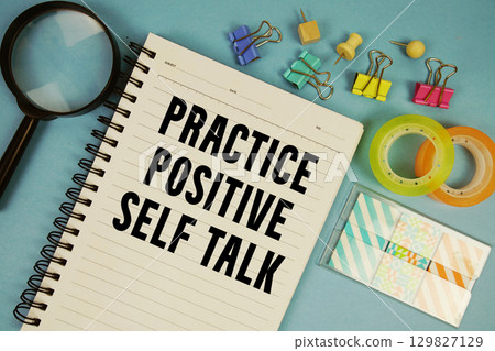 Practice Positive Self Talk text with magnifying glass on blue background Practice Positive Self Talk text with magnifying glass on blue background 129827129