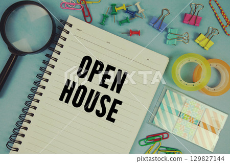 Open House text with magnifying glass on blue background Open House text with magnifying glass on blue background 129827144