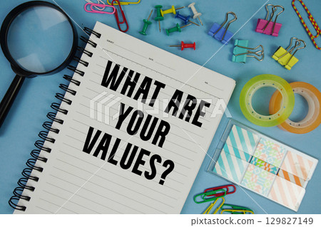 What Are Your Values? text with magnifying glass on blue background 129827149