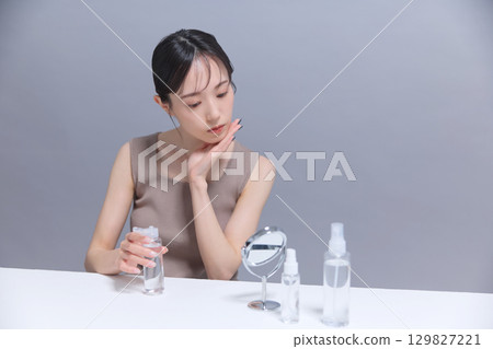 Beauty image: Young woman doing skin care Beauty image: Young woman doing skin care 129827221