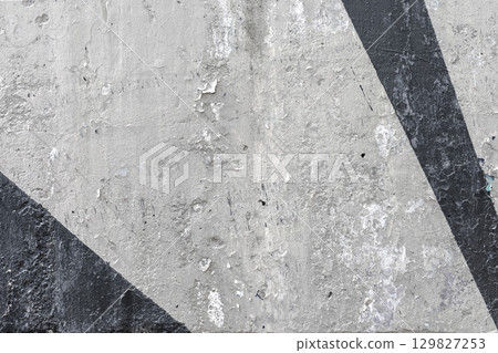 Vintage Textured Wall With Angular Black and Gray Patterns 129827253