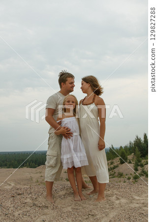 Loving family. Father, mother and daughter outdoors 129827288