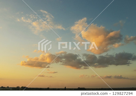 Beautiful sunset over the city. Beautiful sky with clouds. Nature composition. Beautiful sunset over the city. Beautiful sky with clouds. Nature composition. 129827294