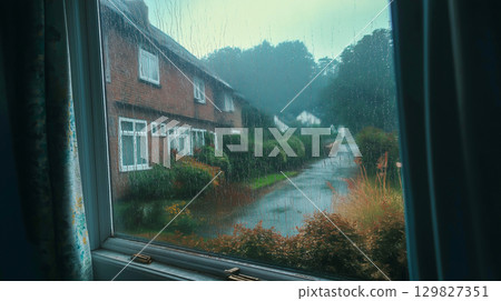 Rainy day view from the window on a quiet street 129827351