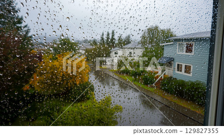 Melancholic rainy day view through the window 129827355