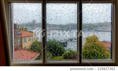 Rainy view from a window in the rural area 129827362