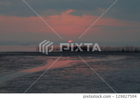 Arao City coast at dusk 129827504