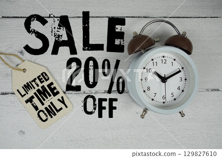Sale 20% Off Limited Time Only with price tag and alarm clock on wooden background Sale 20% Off Limited Time Only with price tag and alarm clock on wooden background 129827610