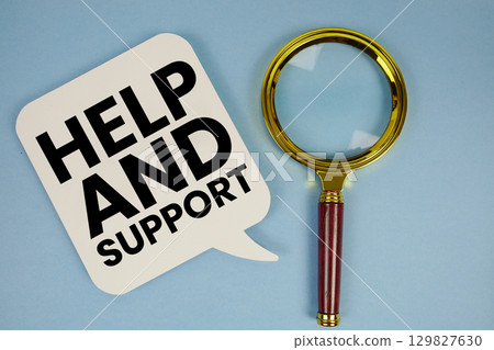 Help and Support text with magnifying glass on blue background Help and Support text with magnifying glass on blue background 129827630