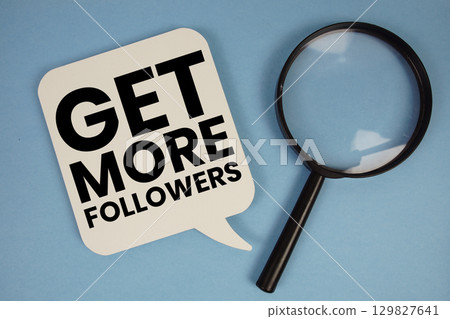 Get More Followers text with magnifying glass on blue background Get More Followers text with magnifying glass on blue background 129827641