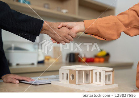 Business Agreement: Client and Agent Shaking Hands Business Agreement: Client and Agent Shaking Hands 129827686