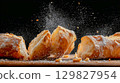 Freshly baked ciabatta bread on a dark background 129827954